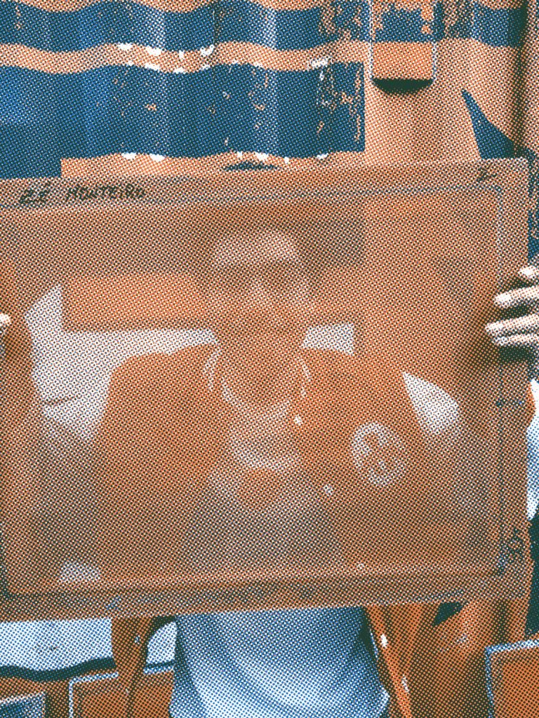 Zé holding a screen printing screen